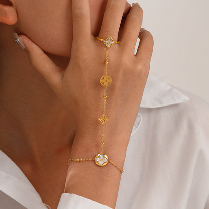 Model Wearing Elegant finger chain bracelet with white shell detail – hypoallergenic and waterproof – STUD