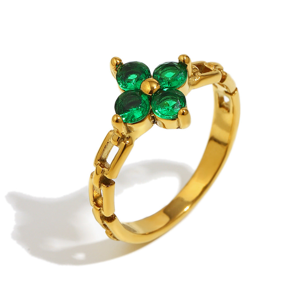 Gold floral ring with green zircon petals and link chain band – STUD