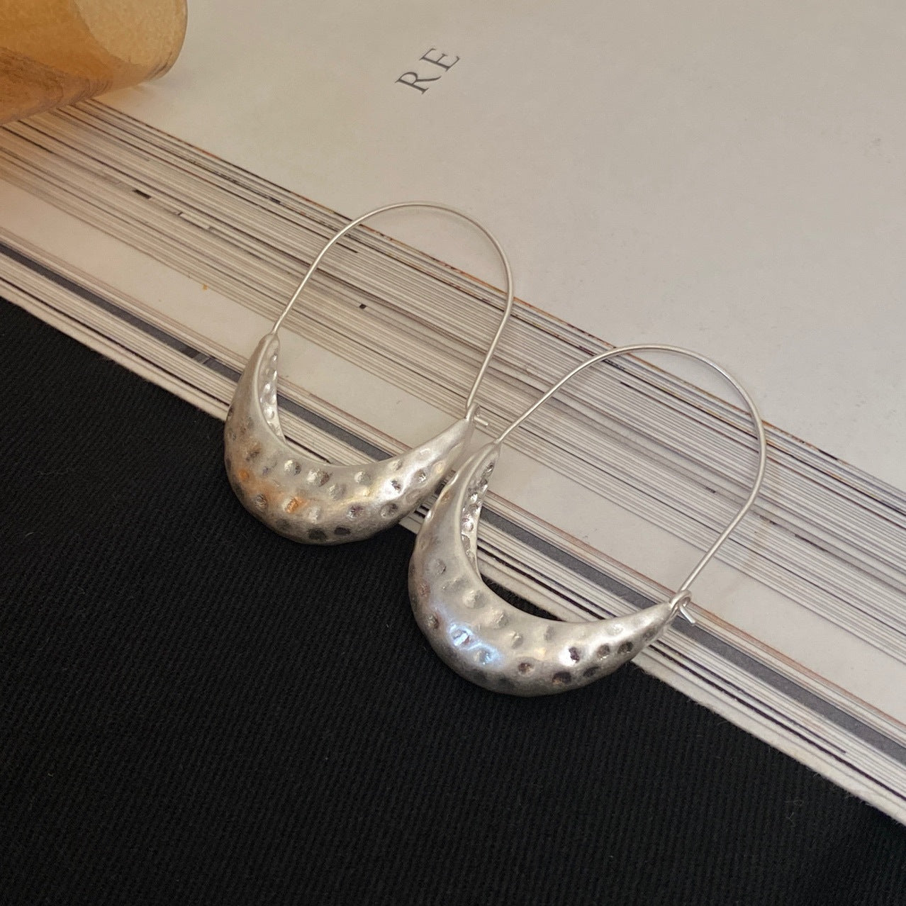 Detail view of Crescent Hoop Earrings by STUD