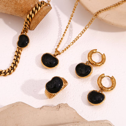 Gold heart necklace with black onyx-inspired centre