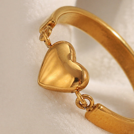 Gold heart ring with minimalist design and 18K gold-plated band