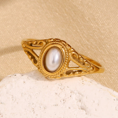 Delicate, feminine, and timeless — this Gold Plated Pearl Flower Ring is designed to elevate any look with understated charm. Featuring a dainty floral motif paired with fine pearls, it captures the essence of modern minimalism and vintage elegance. Made from stainless steel and finished in radiant gold plating, it's waterproof and anti-tarnish — perfect for daily wear without compromising shine or style.