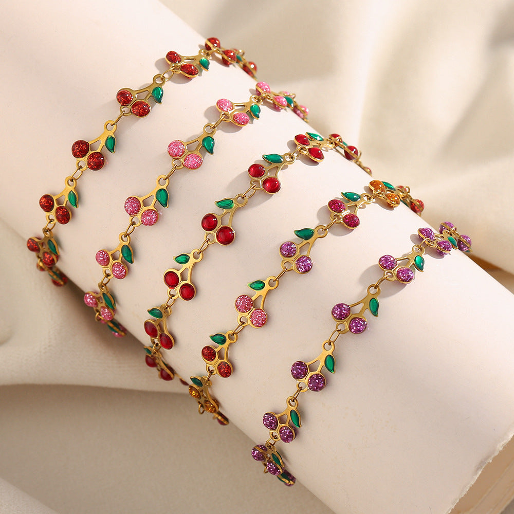 Colorful cherry enamel bracelet with 18K gold finish and leaf details