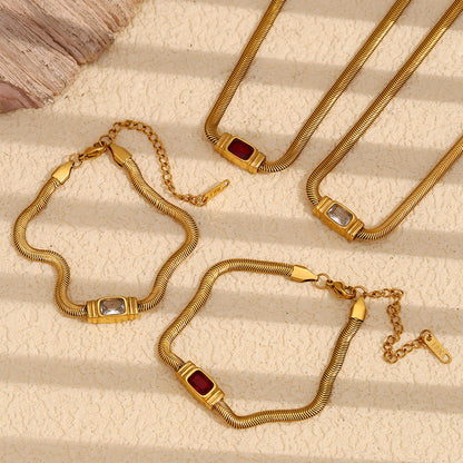 Close-up of zircon accent on snake chain bracelet