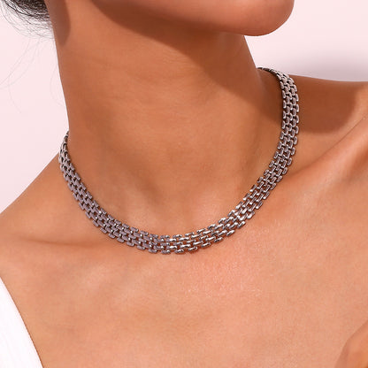 Model wearing handwoven silver necklace