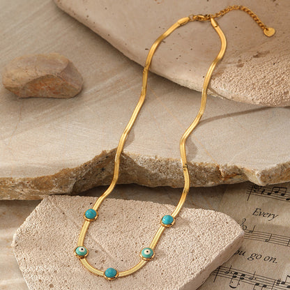 Gold snake chain necklace with evil eye pendant