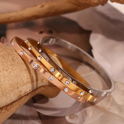 Close detail of clear crystals on rose gold bangle