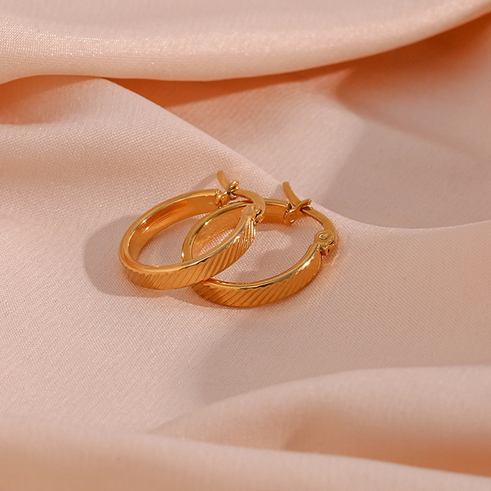 STUD 18K gold-plated slanted textured hoop earrings