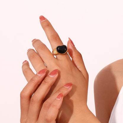 Model wearing black heart ring