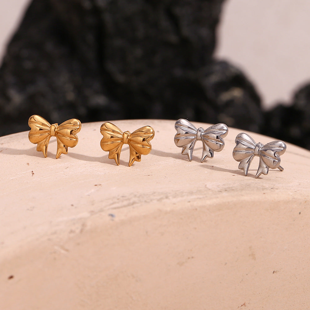Silver bow stud earrings - Dainty 18K plated silver hypoallergenic earrings by STUD