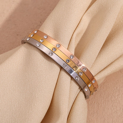 Silver stainless steel zircon bangle with round stones and snap-lock clasp – STUD