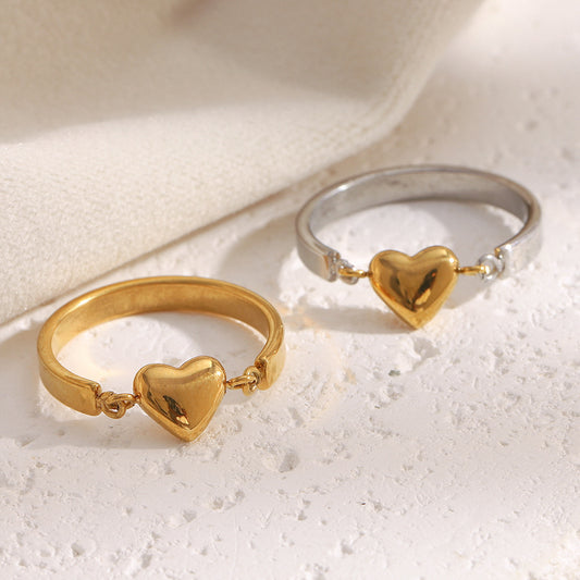 Gold heart ring with minimalist design and 18K gold-plated band
