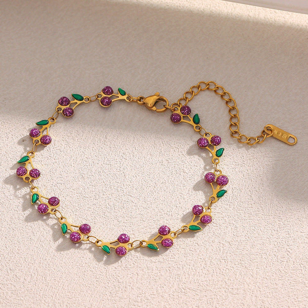 Colorful cherry enamel bracelet with 18K gold finish and leaf details