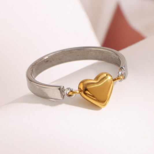 Two-tone ring with silver band and 18K gold heart charm