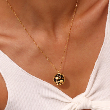 Model wearing gold necklace