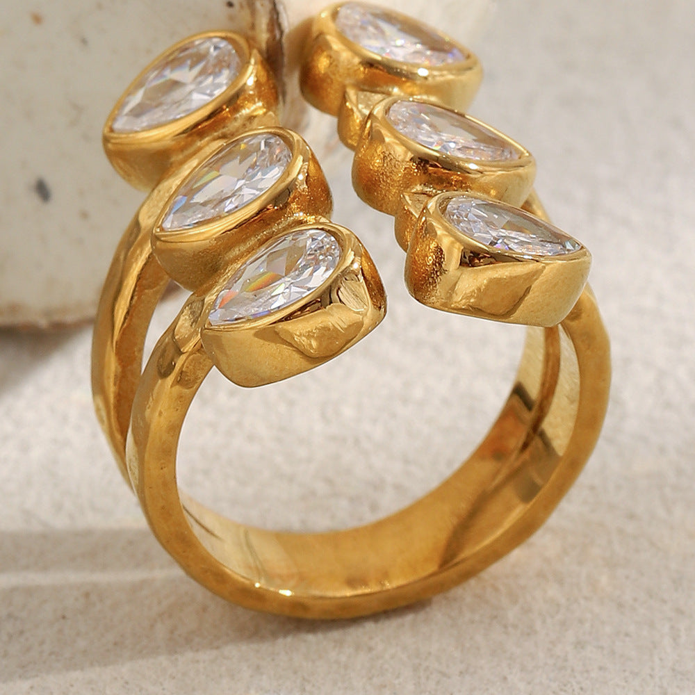 Bold 18K gold-plated open ring with double teardrop zircon stones on hammered stainless steel band – French statement design