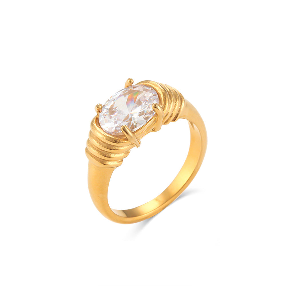 18K gold plated ring with clear oval-cut zircon and textured band – STUD