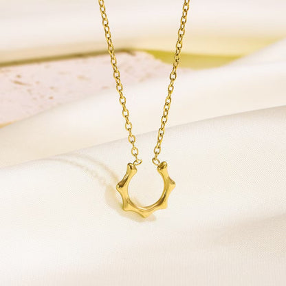 Close-up of Golden Ripple Circle Necklace