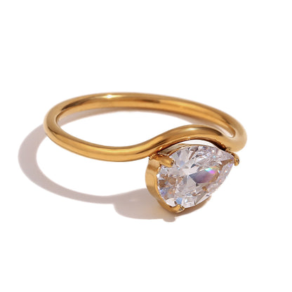 Close up view of oval wavy zircon ring – minimalist 18K gold-plated stainless steel with sculpted design and shimmering stones – by STUD (Shop Till You Drop)