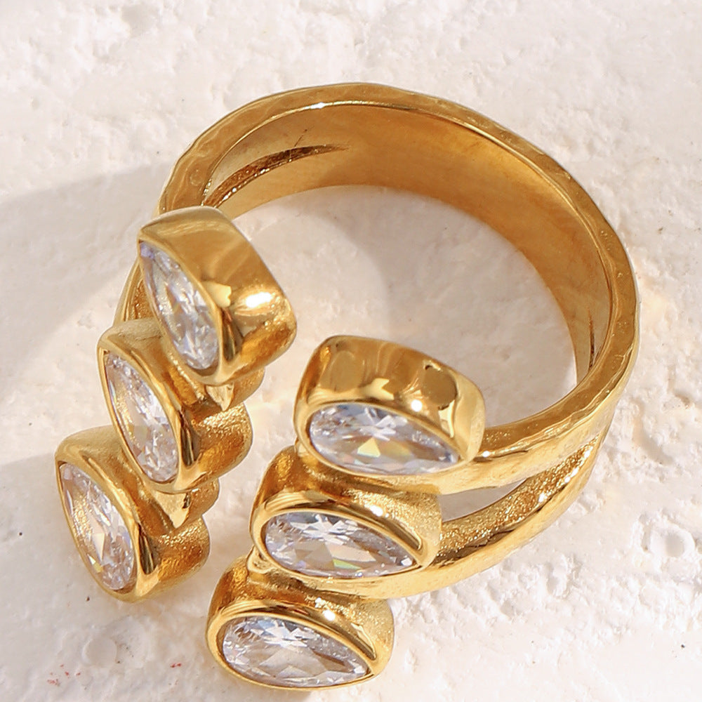 Bold 18K gold-plated open ring with double teardrop zircon stones on hammered stainless steel band – French statement design