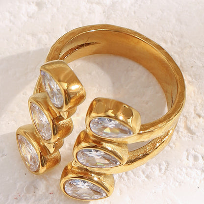 Bold 18K gold-plated open ring with double teardrop zircon stones on hammered stainless steel band – French statement design