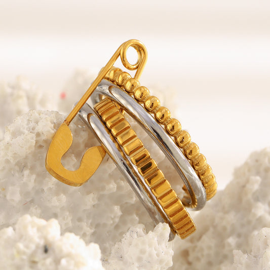 4-layer gold and silver ring with safety pin design, beaded and textured bands