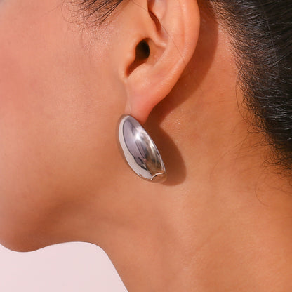 Model Wearing Silver hollow teardrop bead earrings – 3D design, polished stainless steel, hypoallergenic by STUD (Shop Till You Drop)