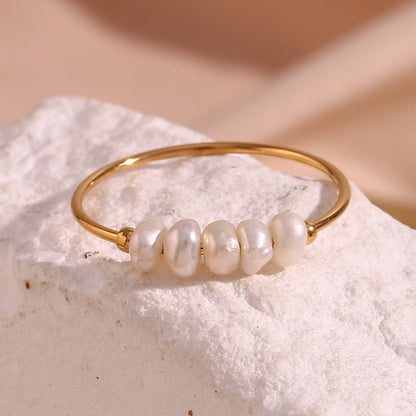 close up view of Freshwater pearl ring – delicate 18K gold-plated stainless steel band with minimalist pearls – elegant jewelry by STUD (Shop Till You Drop)

