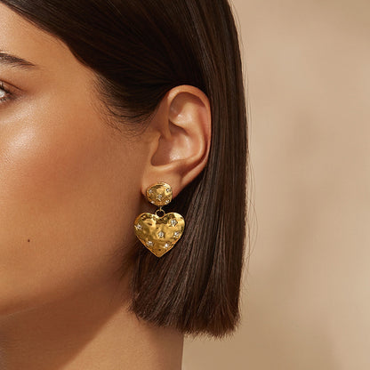 Model Wearing Golden Glam 14K gold-plated heart and star earrings with zirconia – waterproof, hypoallergenic by STUD (Shop Till You Drop)