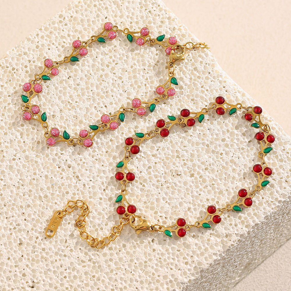 Colorful cherry enamel bracelet with 18K gold finish and leaf details
