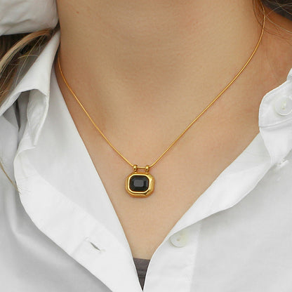 Model Wearing Black zircon pendant necklace with lock design – 18K gold plated by STUD-Shop Till You Drop