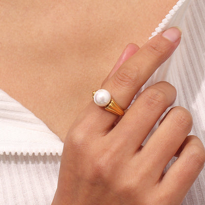 Model wearing Textured pearl ring with dual-sided band – 18K gold-plated stainless steel with faux pearl center – elegant jewelry by STUD (Shop Till You Drop)