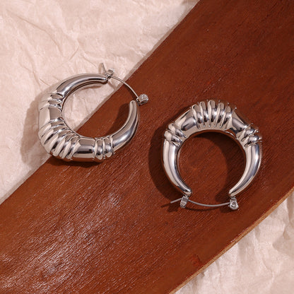 Top View of Vintage-inspired silver hoop earrings – triple-stripe 18K gold-plated, waterproof by STUD (Shop Till You Drop)


