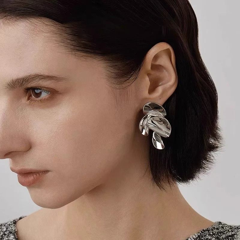 Glossy leaf-inspired stud earrings by STUD