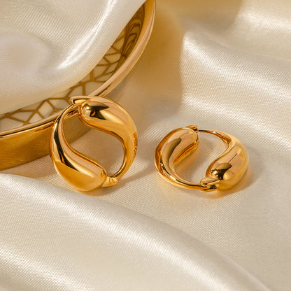 Close View of Yin-yang gold hoop earrings with double fish design – 18K gold-plated, waterproof, hypoallergenic by STUD (Shop Till You Drop)