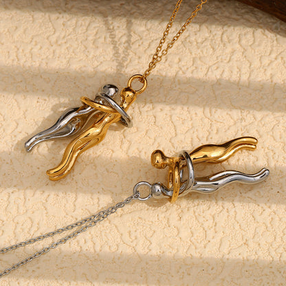 Detail view of lovers embrace necklace pendant