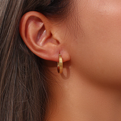 STUD 18K gold-plated slanted textured hoop earrings