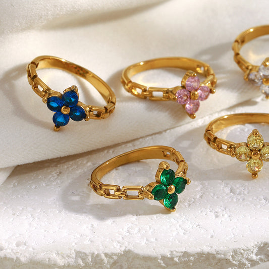 Gold floral ring with green zircon petals and link chain band – STUD