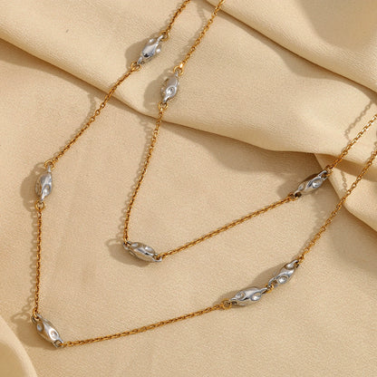 Close view of two-tone beaded layered necklace