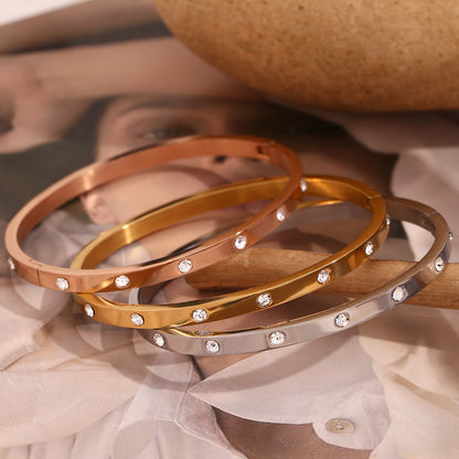 18K gold plated bangle bracelet with round zircon stones and clasp lock – STUD