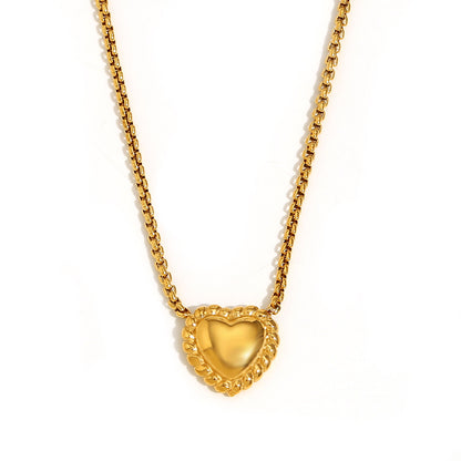 Close-up of Twisted Gold Heart Necklace by STUD