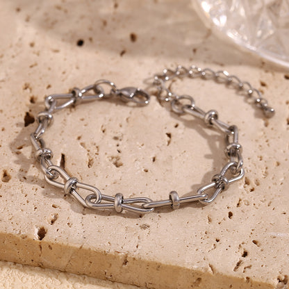 Close View of Elegant handcrafted stainless steel bowknot bracelet in silver with minimalist design – waterproof and hypoallergenic