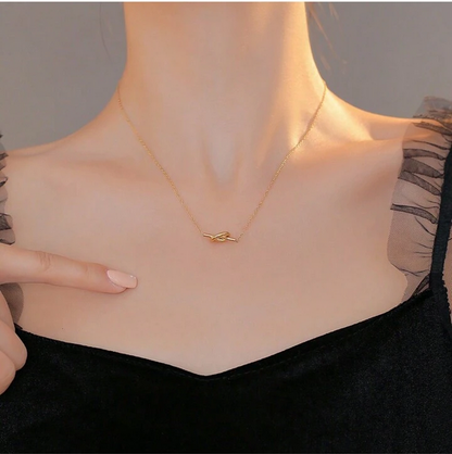Model Wearing Korean-style knot necklace – 14K gold plated stainless steel by STUD-Shop Till You Drop